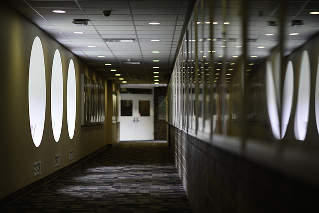 Round windows in tunnel bridge linking Wilson Commons to Eastman Quad.